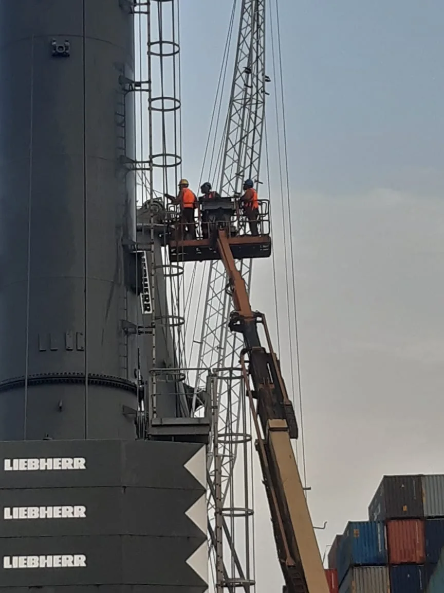 NOC technicians accessing a storage tank